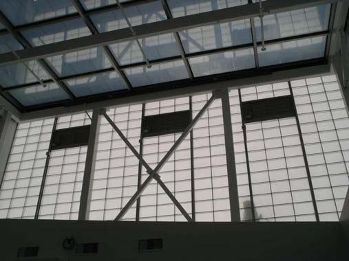 Advanced entry vestibule with thin-film PV glazing roof and translucent upper walls
