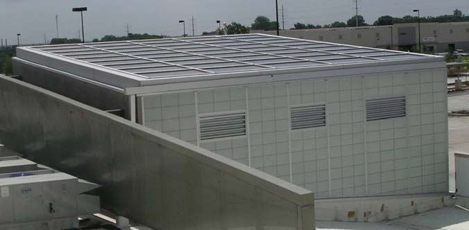 Roof and top of one of the entrance vestibules (PV Arrays 1 and 2), showing translucent siding and vent louvers