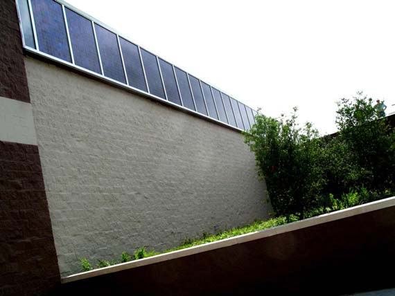 PV Array 5 blue stripe polycrystalline modules extending beyond the clerestory glazing